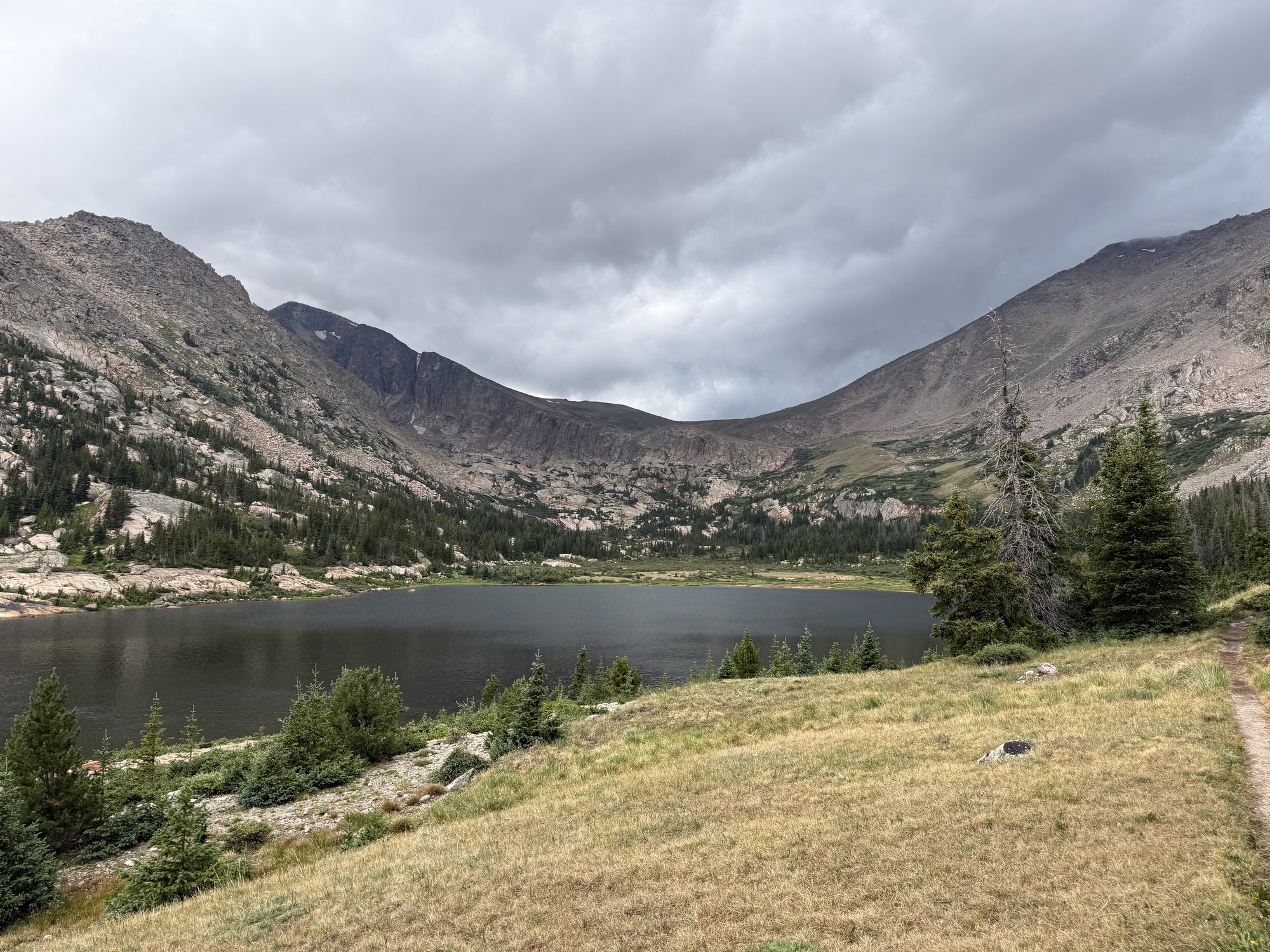 Lawn Lake under a sky making up its mind — the weather that became Tuesday's hailstorm.